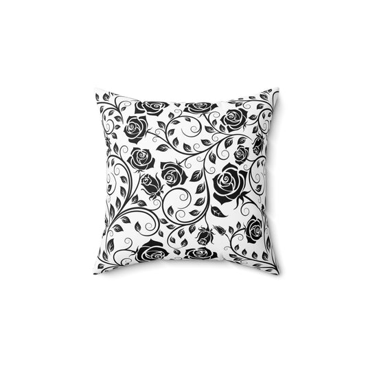 Decorative pillow with black floral pattern on a white background