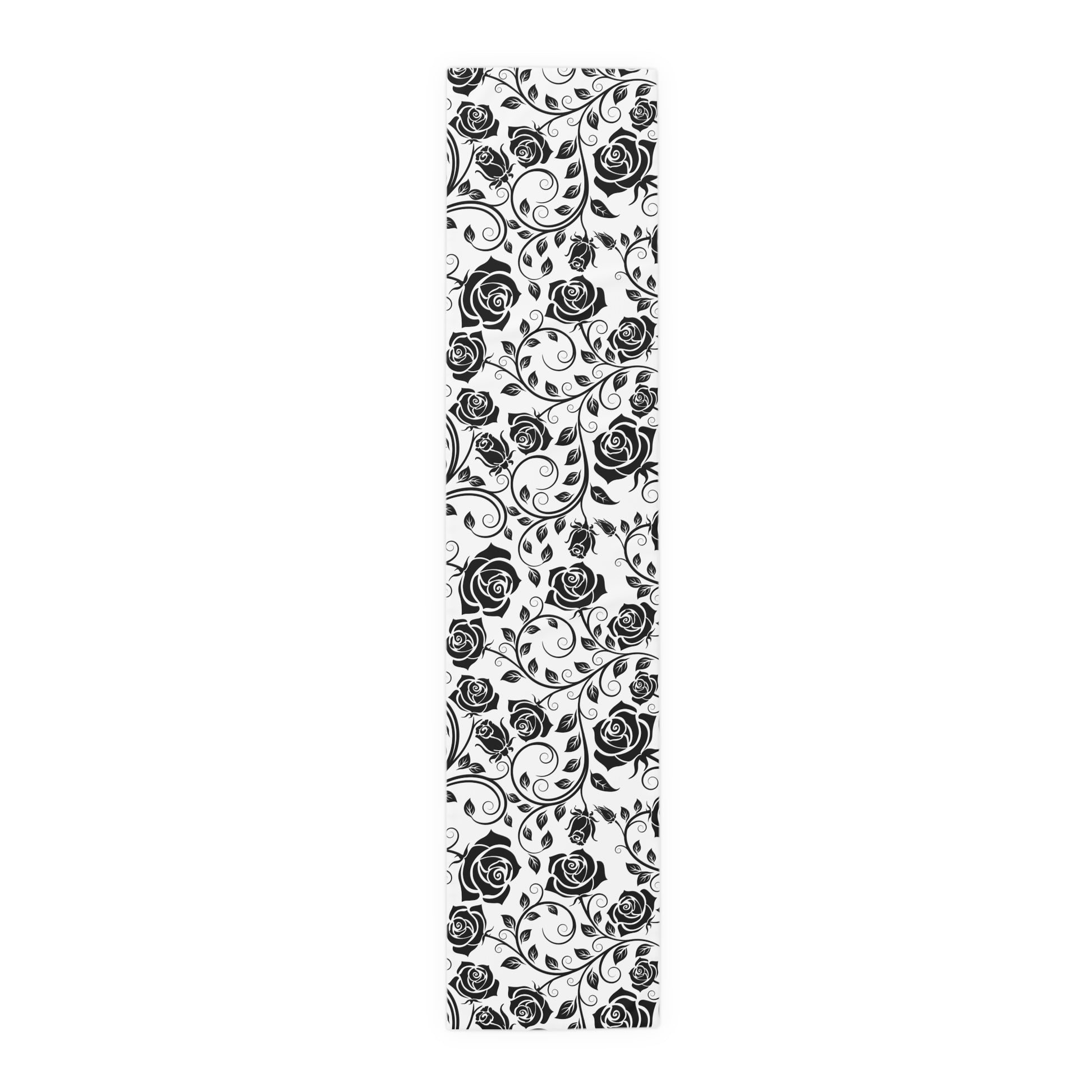 Black floral pattern on a table runner on a white background