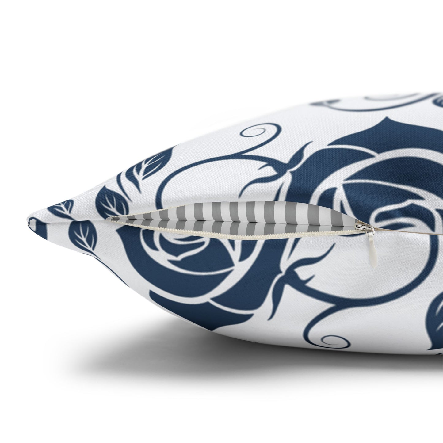 Decorative pillow with blue floral pattern on a white background