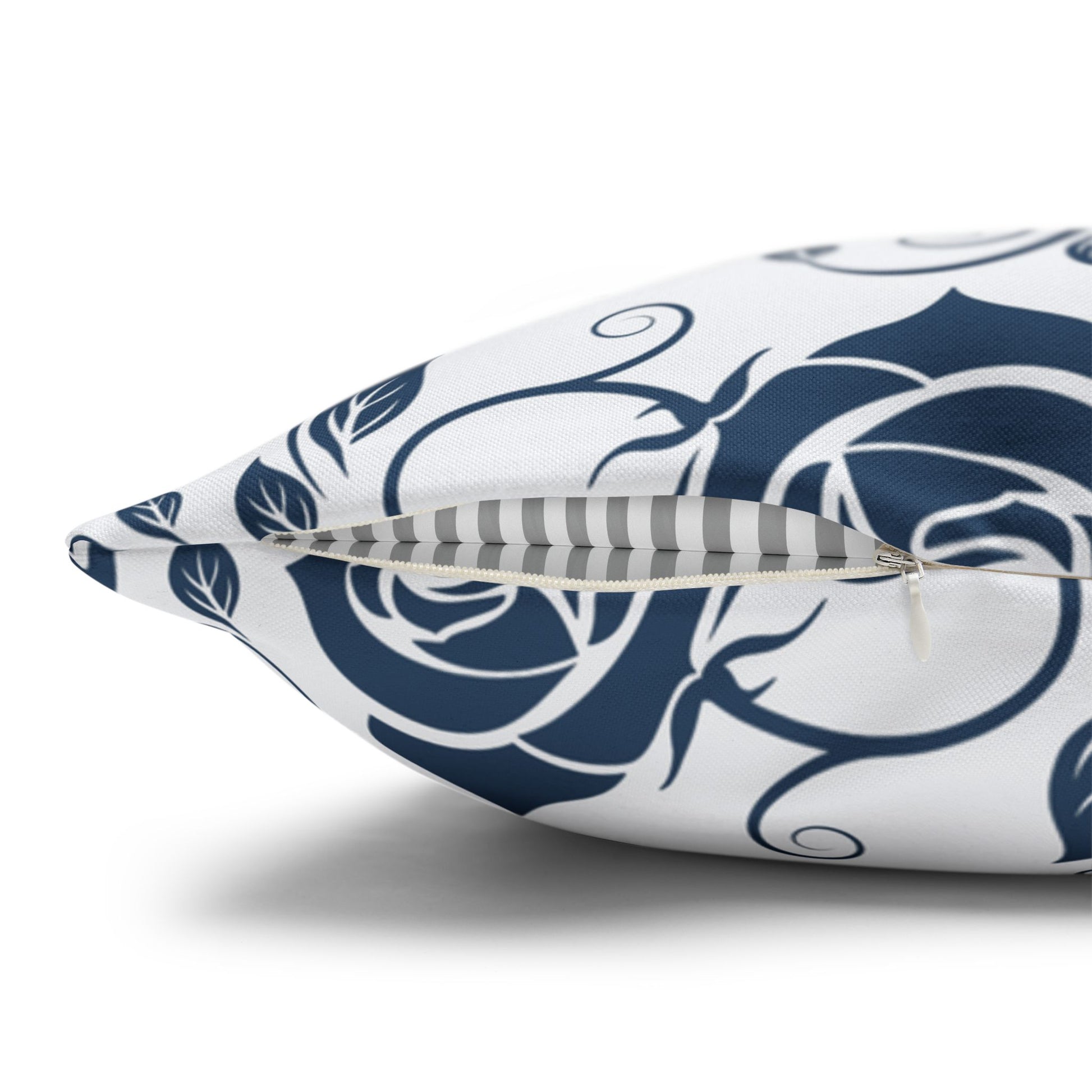 Decorative pillow with blue floral pattern on a white background