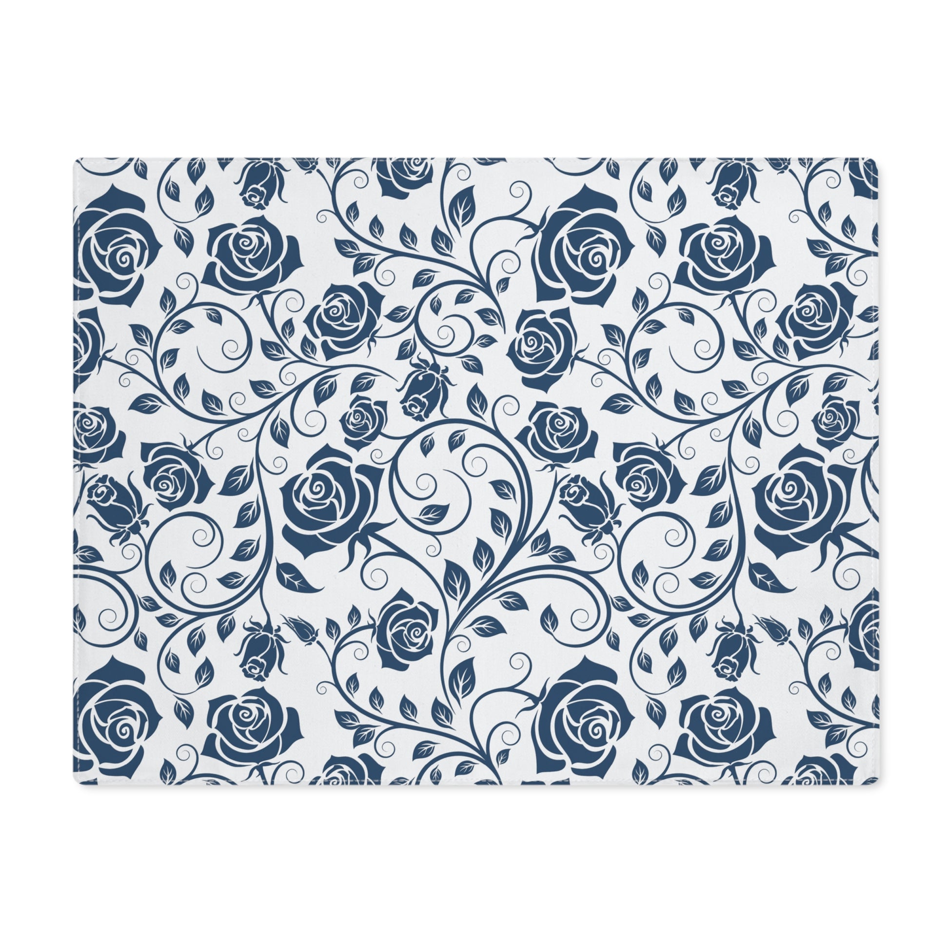 Floral pattern placemat with blue roses on a white background