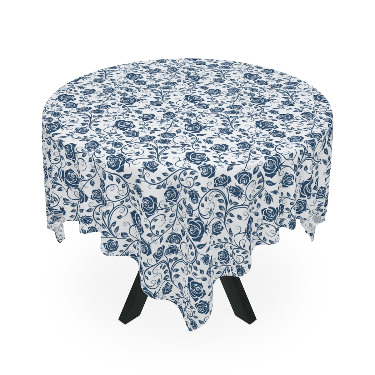 Round table with a blue floral patterned tablecloth on a white background