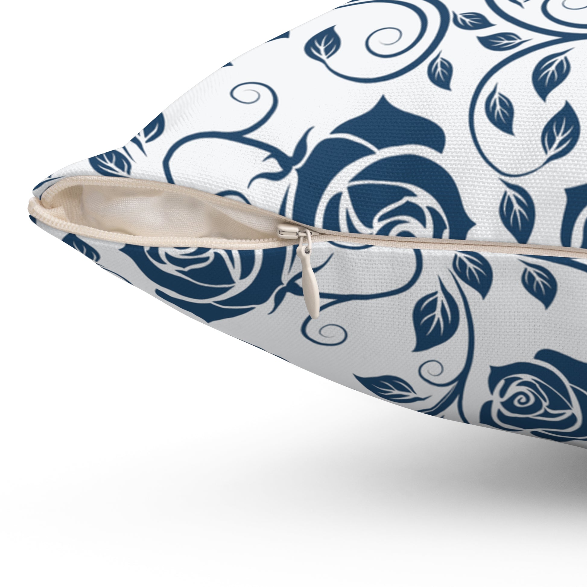 Decorative pillow with blue floral pattern with zipper closure on a white background