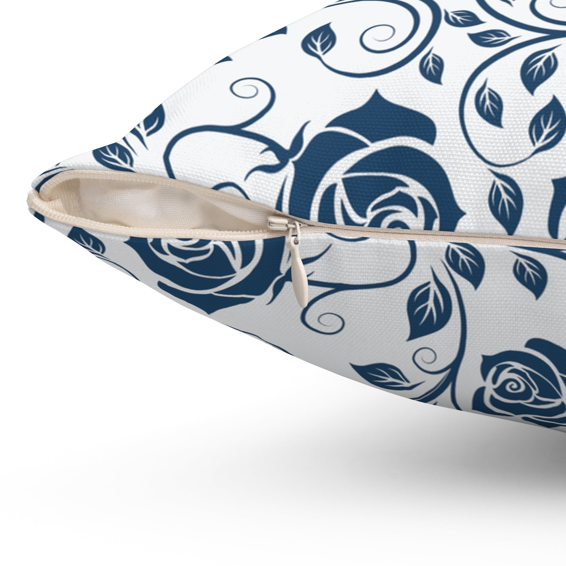 Pillow with blue floral pattern with zipper closure on a white background