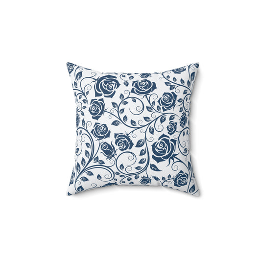 Decorative pillow with blue rose pattern on a white background