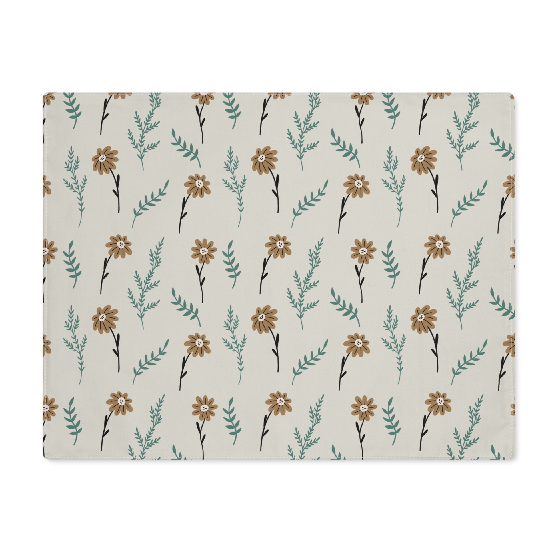 Our Brown Camomile placemat with brown and gray cotton twill fabric with small flowers and leaves on a beige background