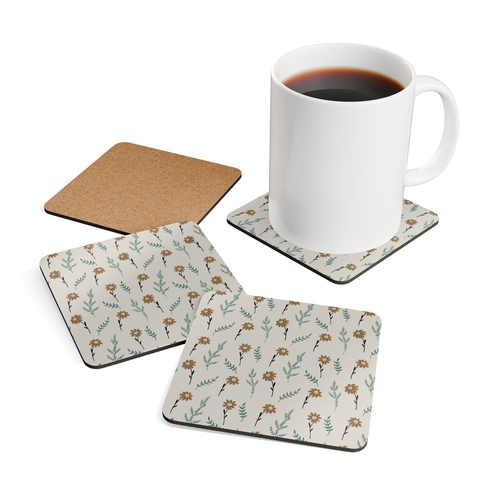 Set of 4 brown floral coasters with gray background with a white mug on a white background