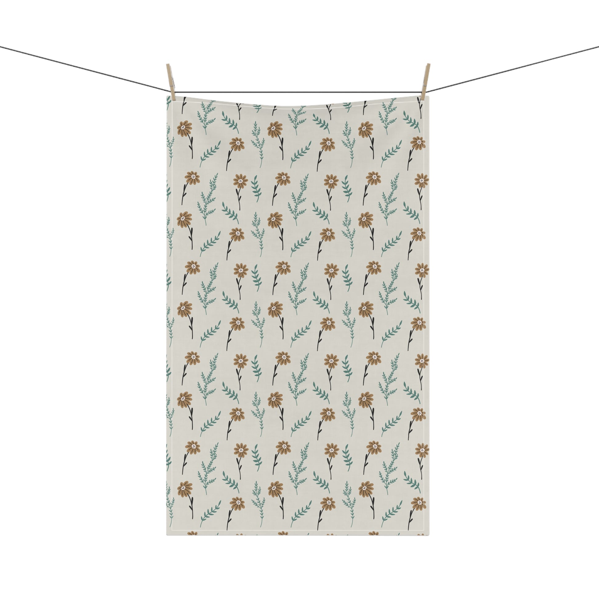 Brown floral patterned towel hanging on a clothesline