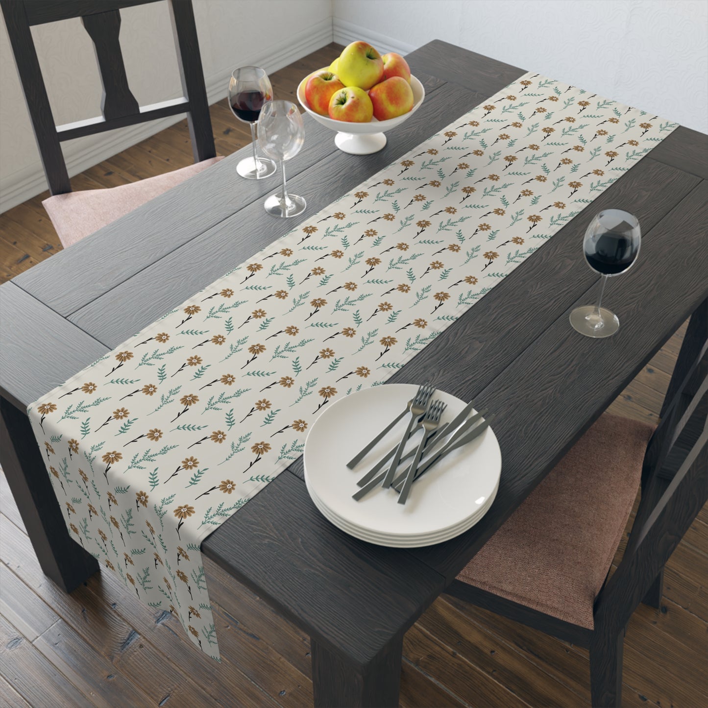 Table setting with our Brown Chamomile table runner that has a brown and gray floral-pattern on the table runner on a wooden table.