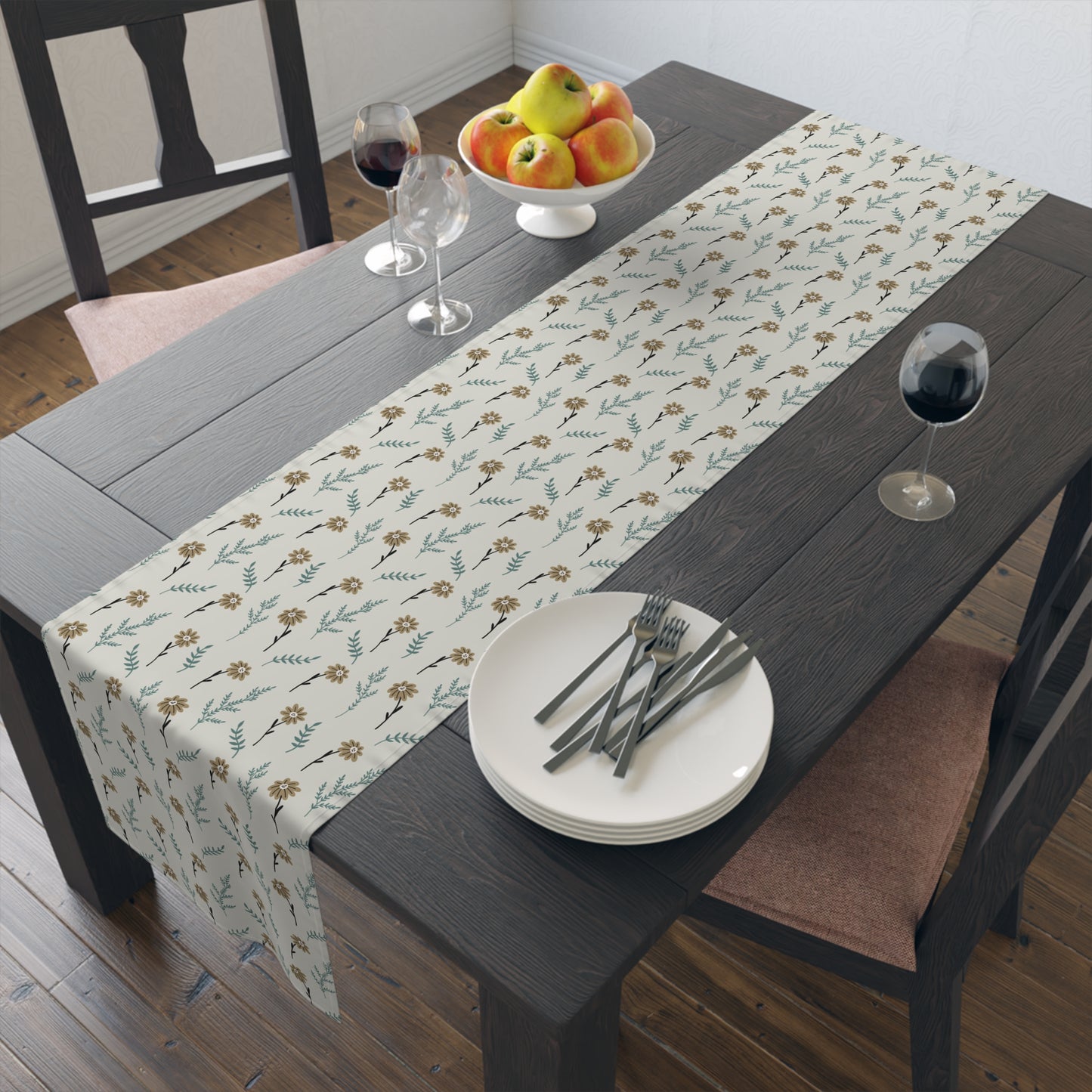Dining table with our Brown Chamomile table runner that has a brown and gray floral-pattern on the table runner, plates, cutlery, and fruit.
