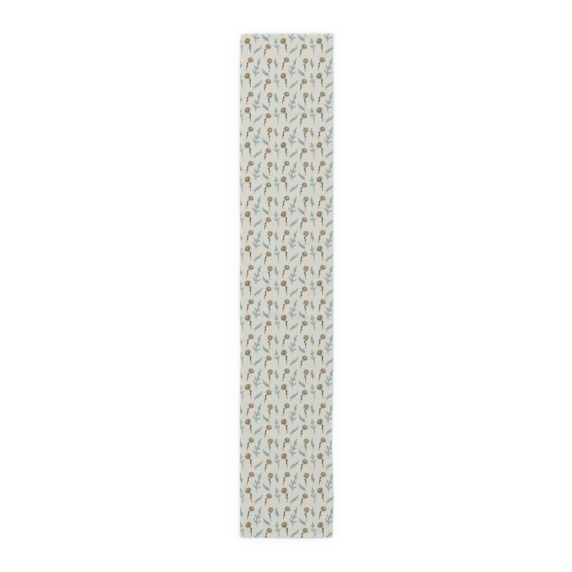 Our cotton twill 16" x 90" Brown Chamomile table runner that has a brown and gray floral-pattern on the table runner on a white background