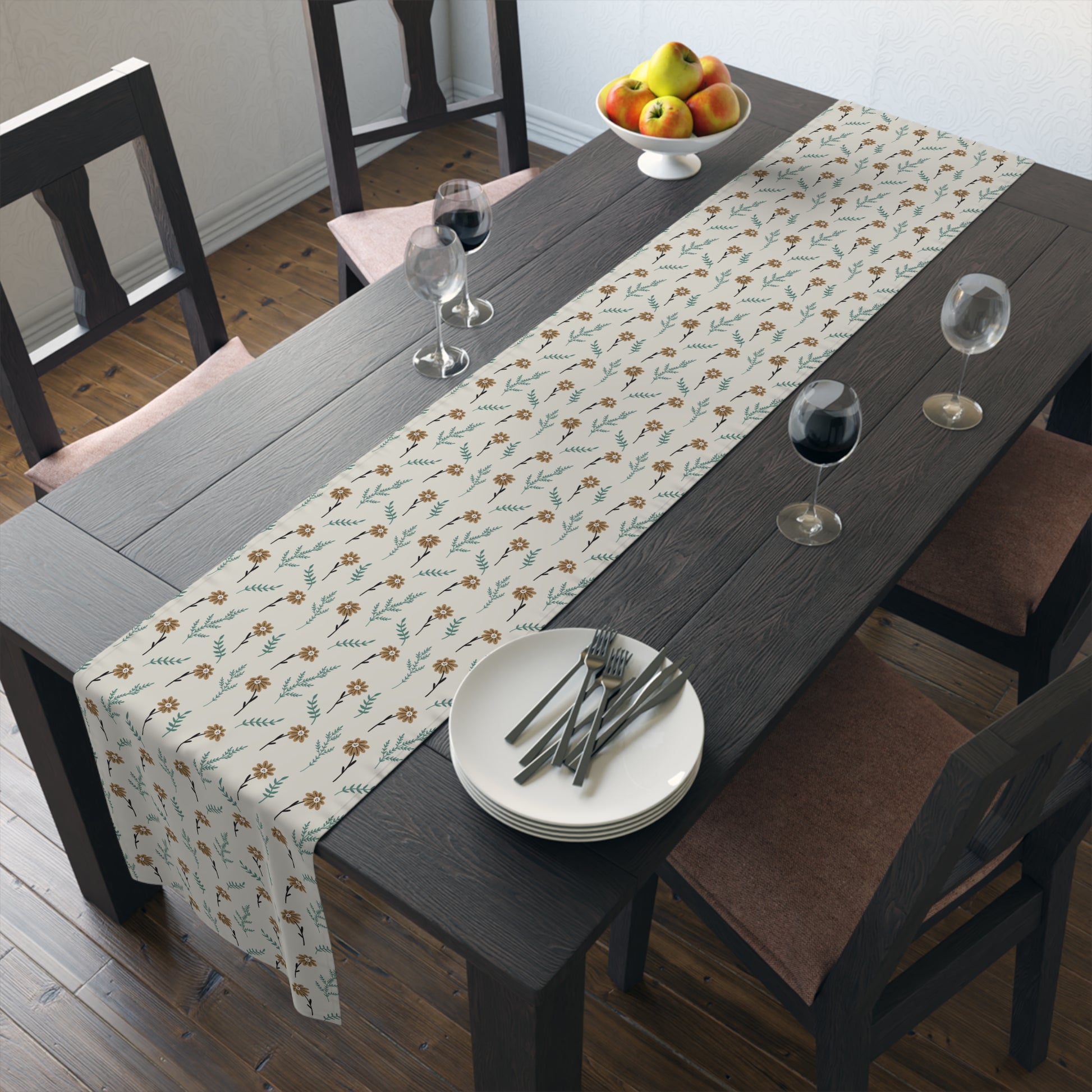 Dining table with our Brown Chamomile table runner that has a brown and gray floral-patterned table runner, plates, and glasses.