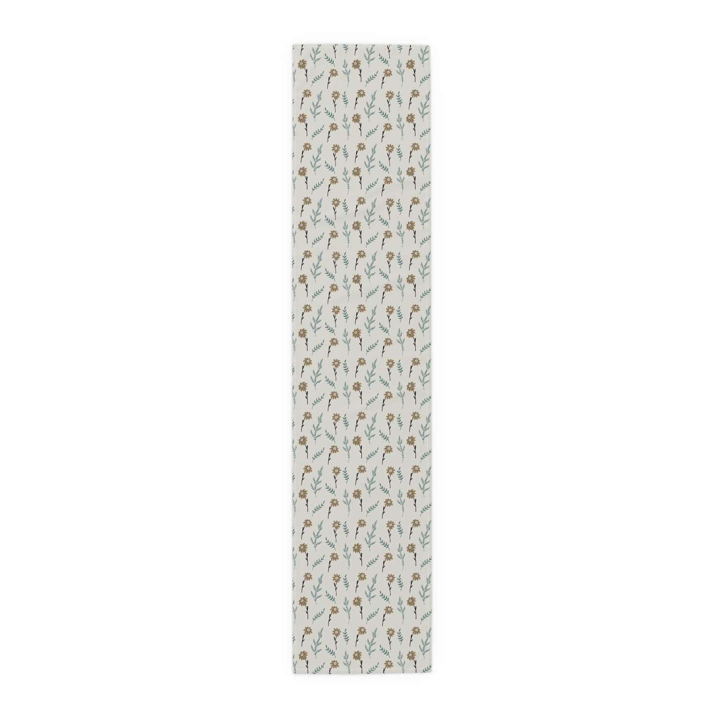 Our cotton 16" x 72 Brown Chamomile table runner that has a brown and gray floral-pattern on the table runner on a white background