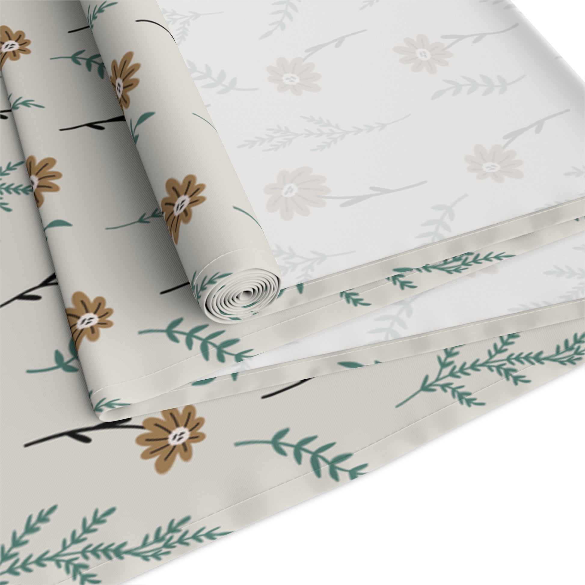 Rolled our Brown Chamomile table runner that has a brown and gray floral-patterned fabric with flowers and leaves on a white background