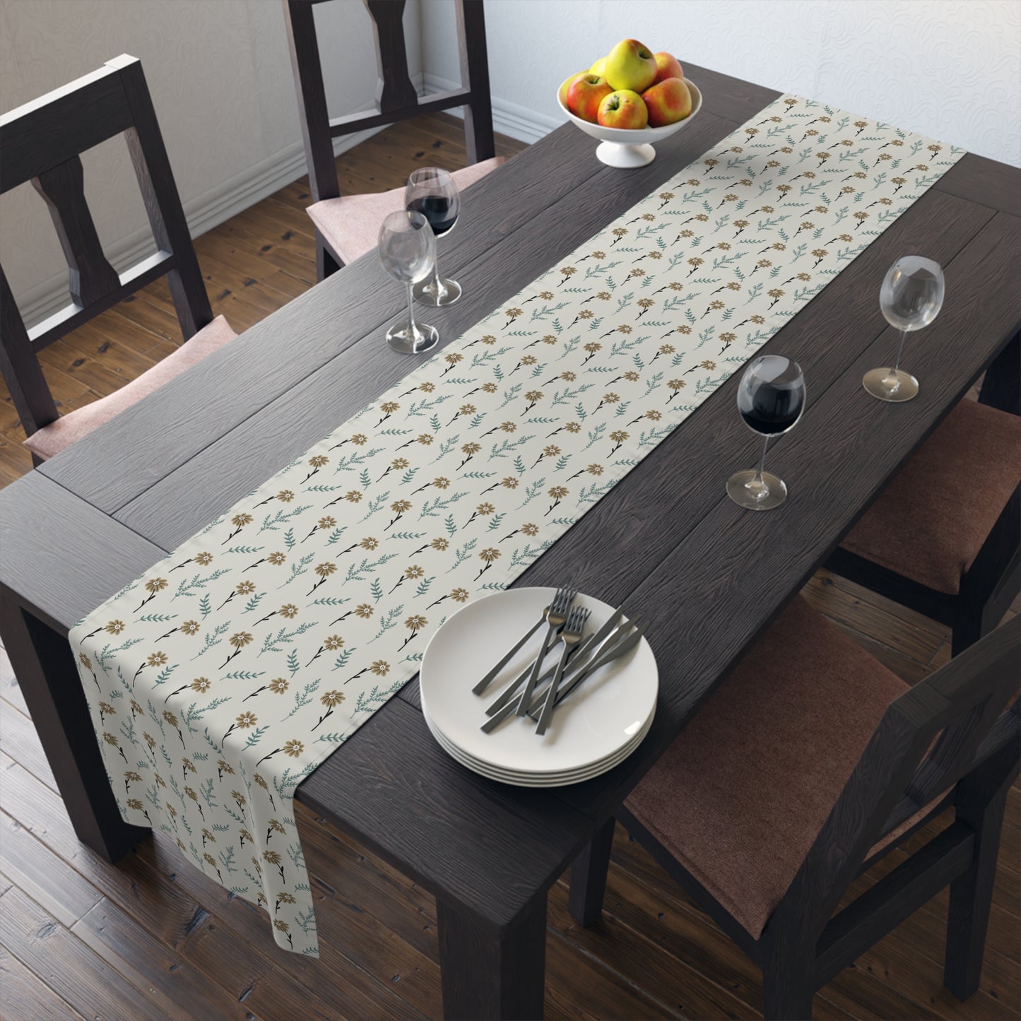 Dining table with our Brown Chamomile table runner that has a brown and gray floral-pattern on the table runner, plates, and glasses.