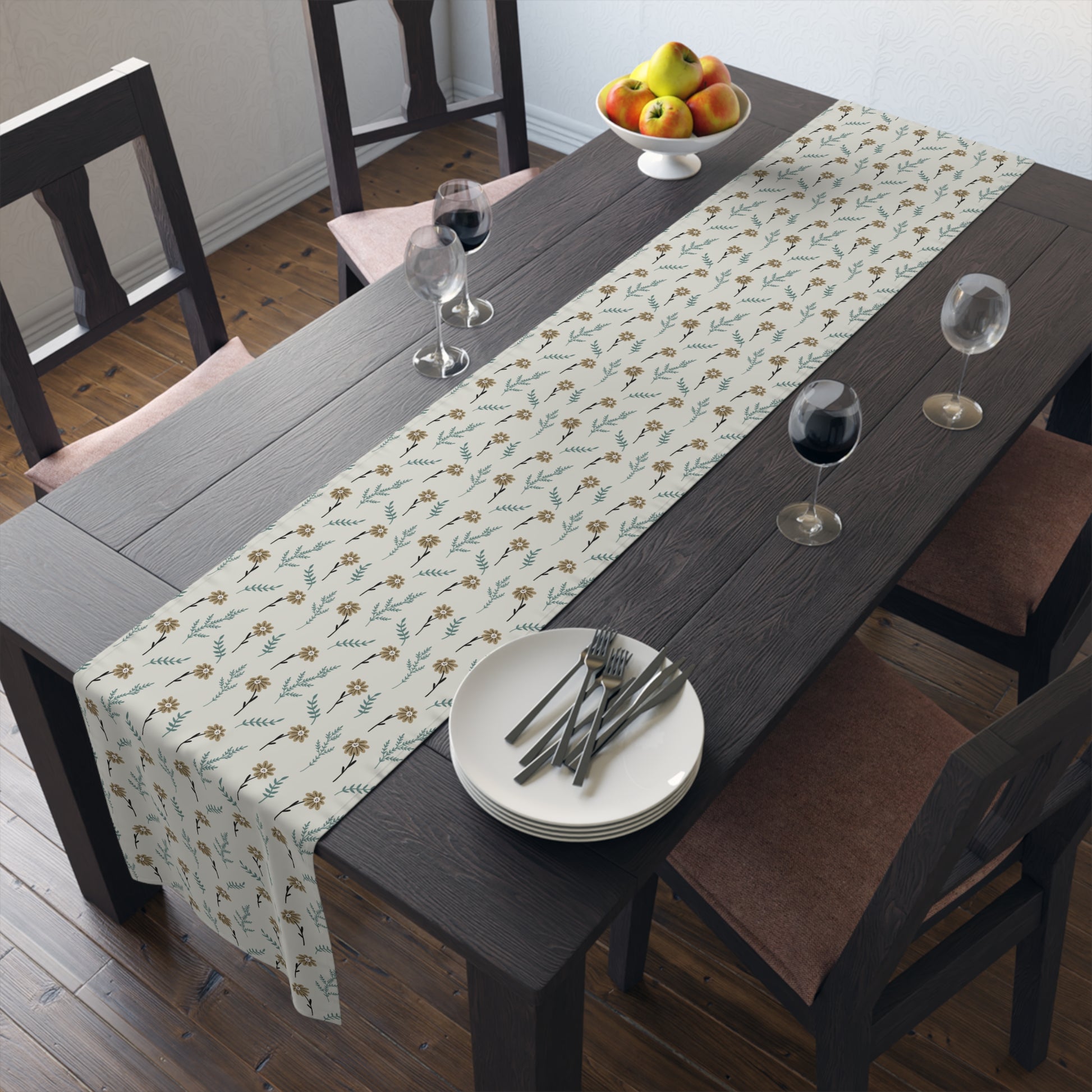 Dining table with our Brown Chamomile table runner that has a brown and gray floral-pattern on the table runner, plates, and glasses.