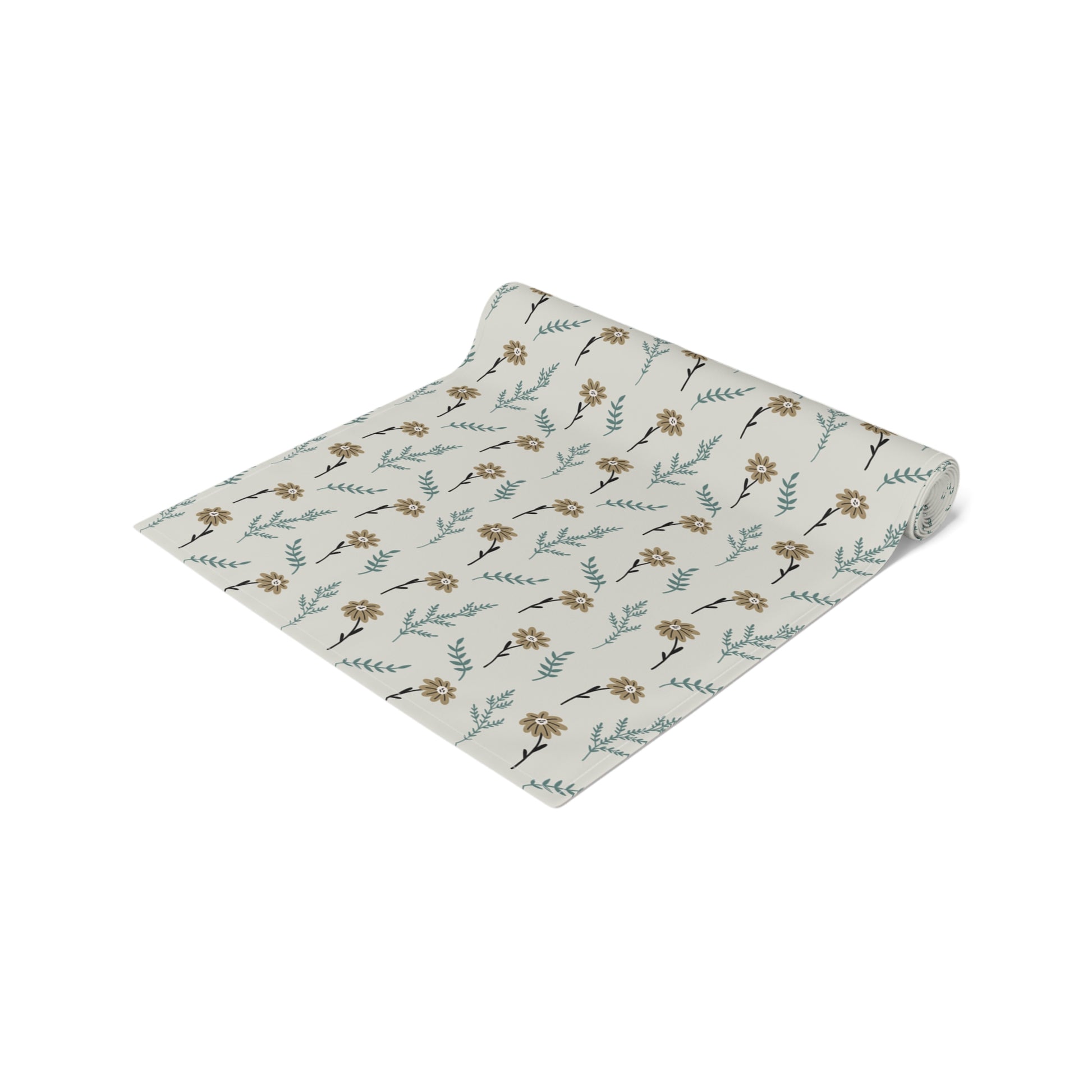 our Brown Chamomile table runner rolled that has a brown and gray floral-pattern on the table runner with on a white background