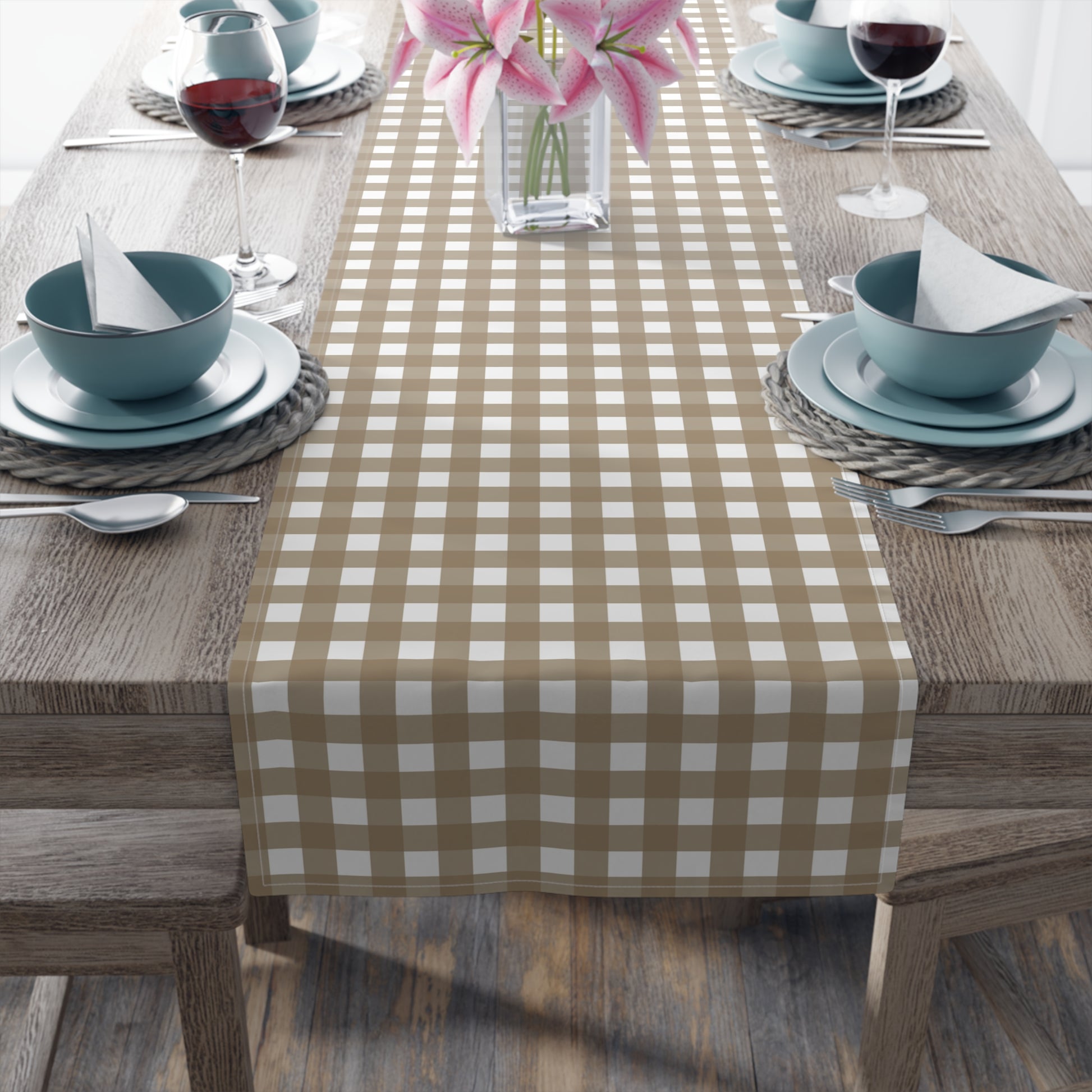 Dining table set with our Brown Gingham checkered table runner, plates, bowls, and glasses.