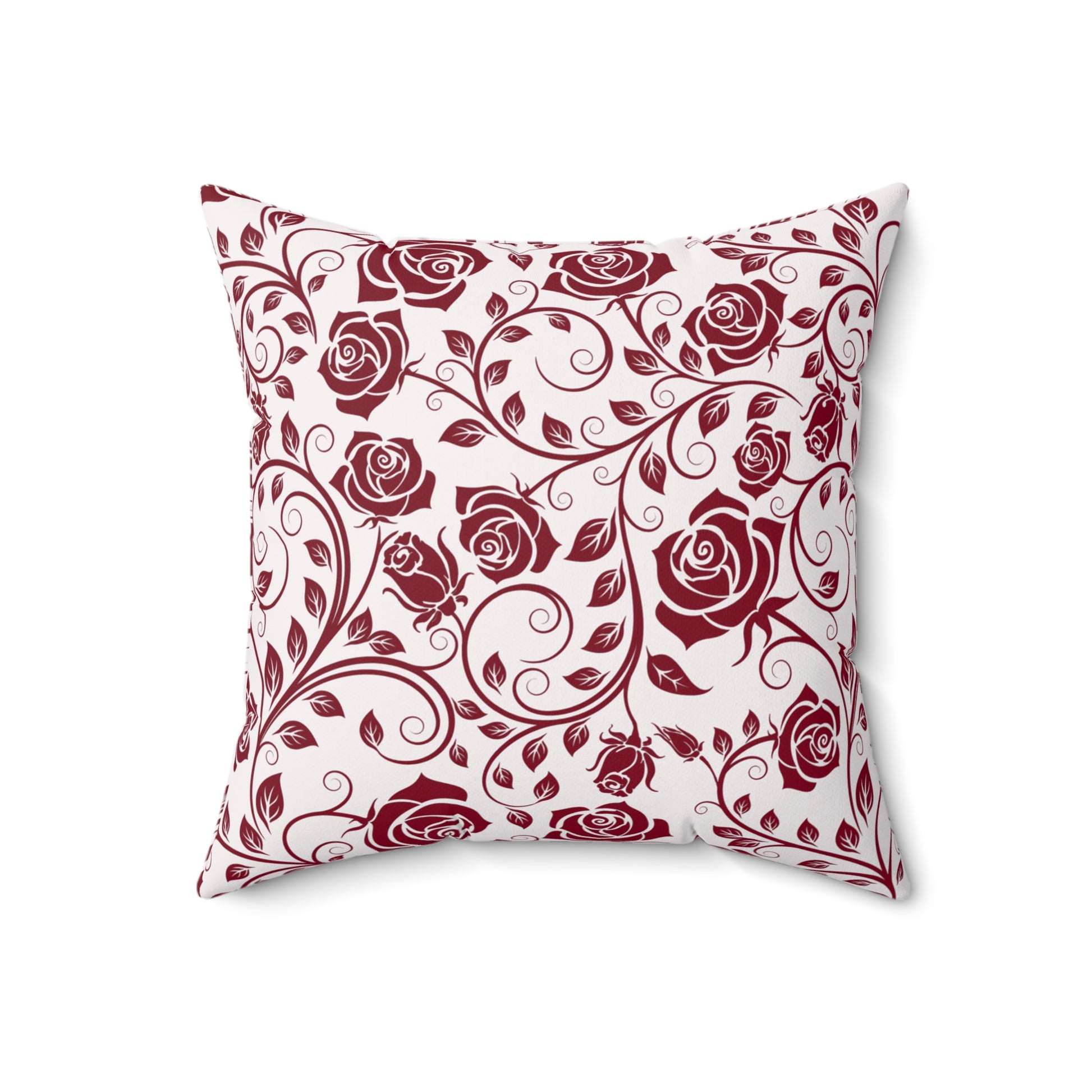 Decorative pillow with burgundy red rose pattern on a white background