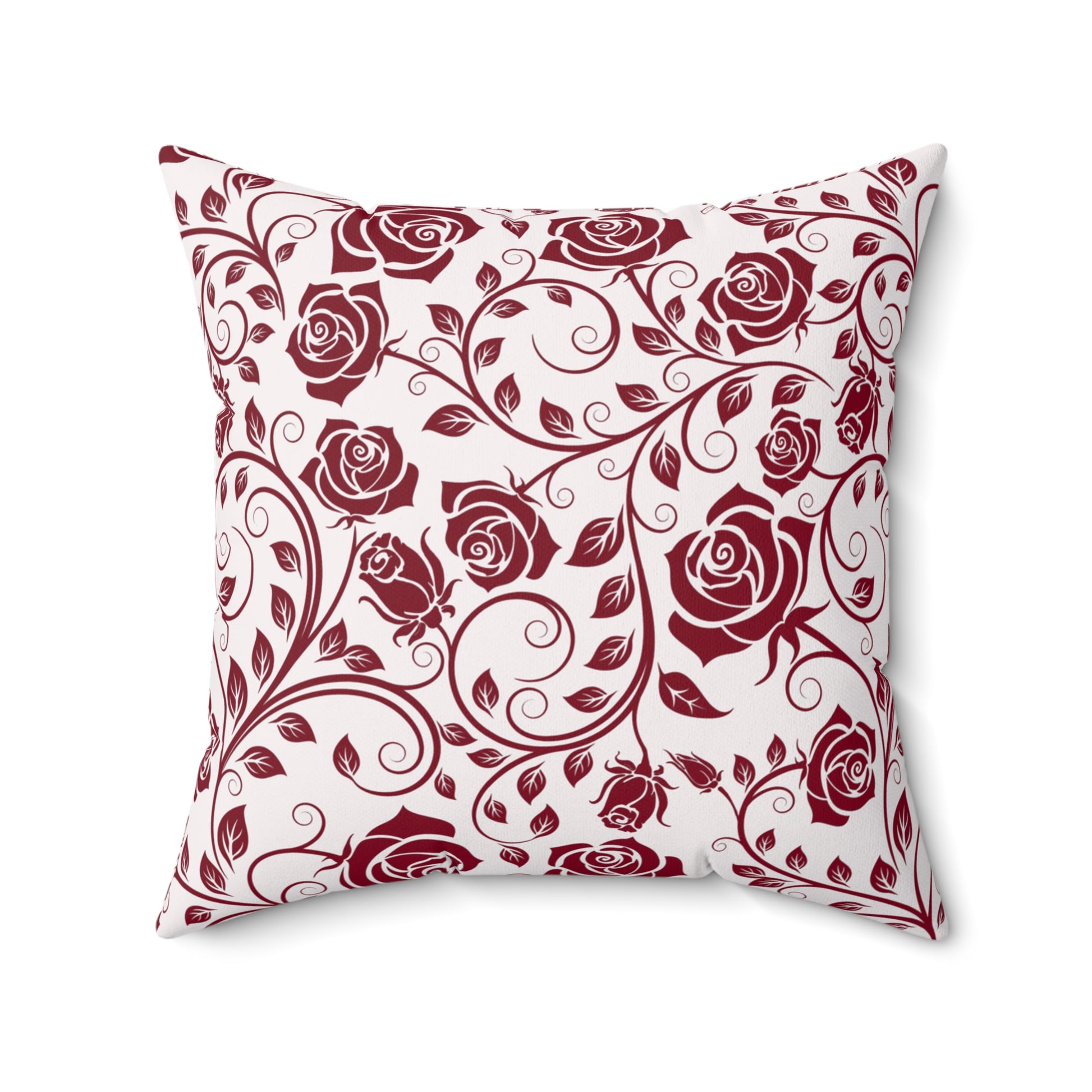 Decorative pillow with burgundy red rose pattern on a white background