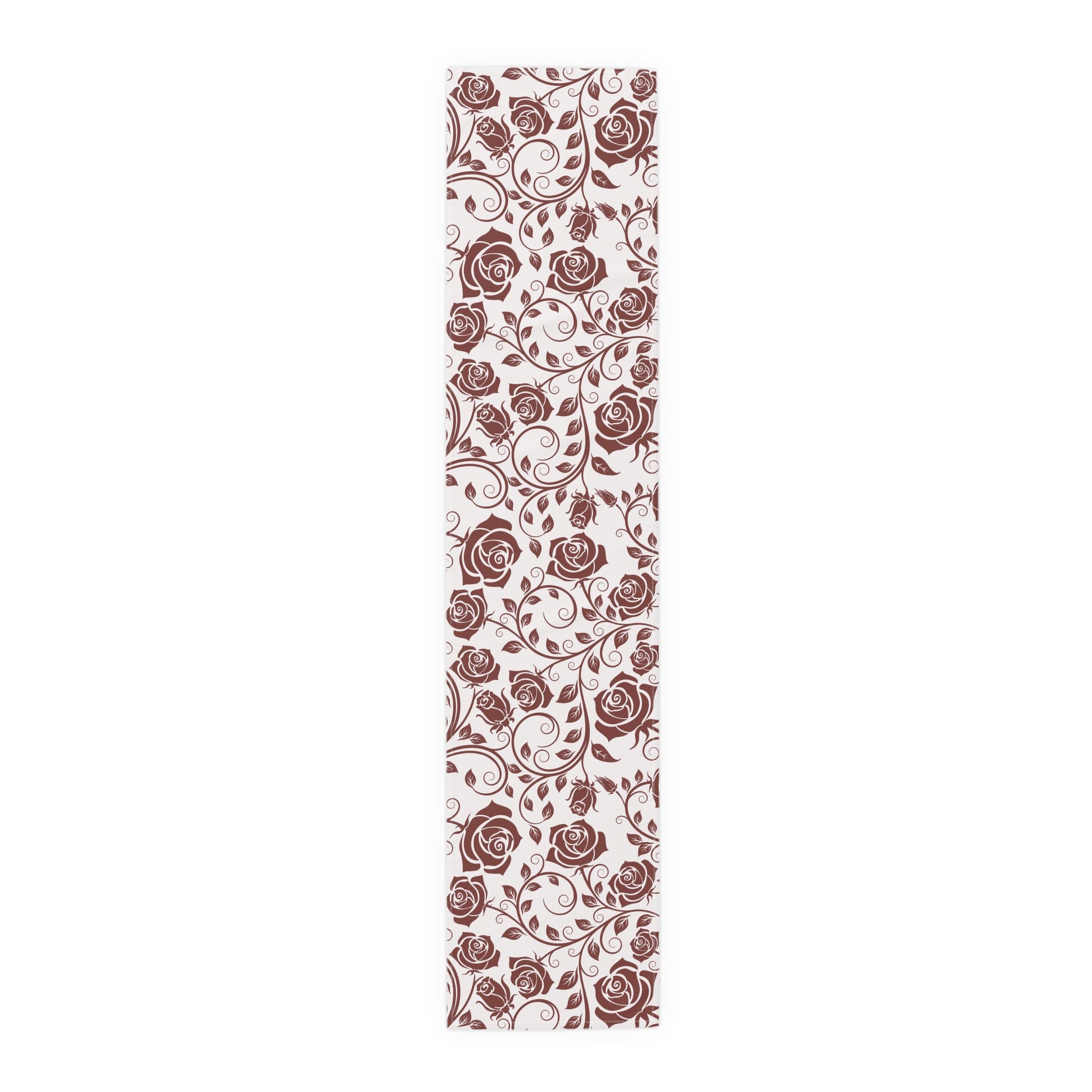 Table runner with red floral pattern on a white background