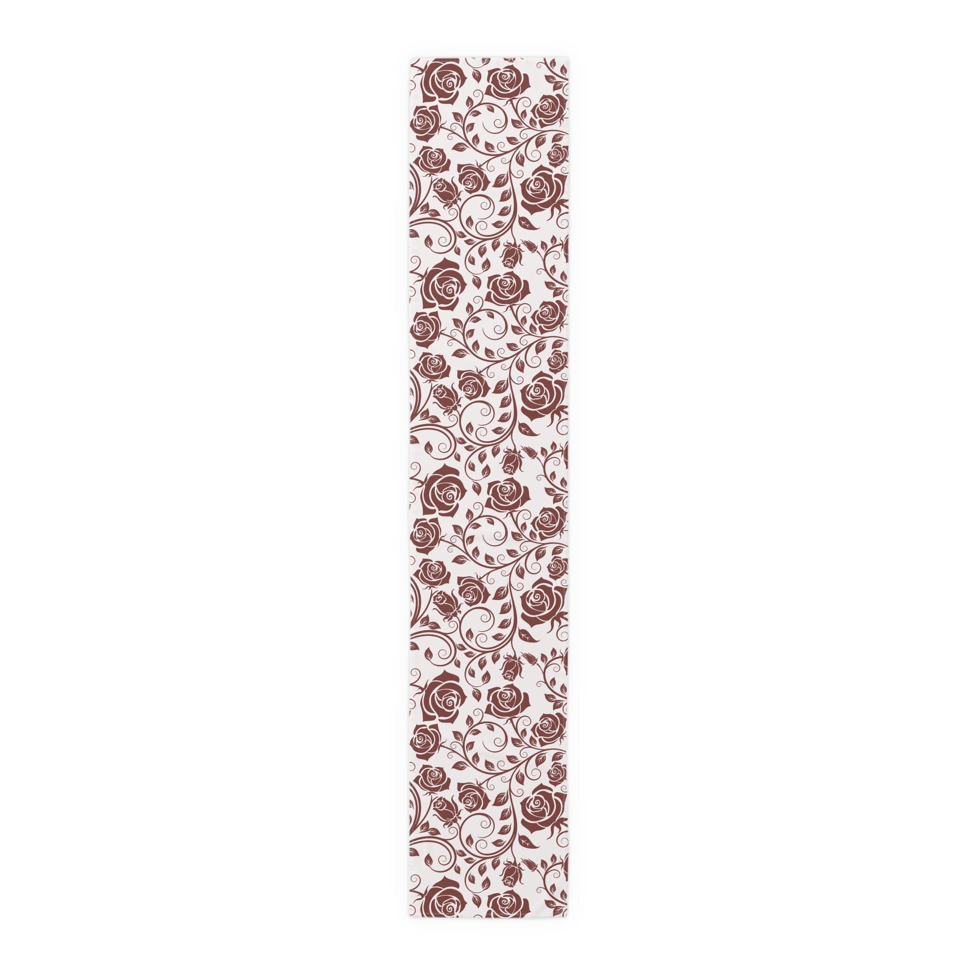 Decorative table runner with red rose pattern on a white background