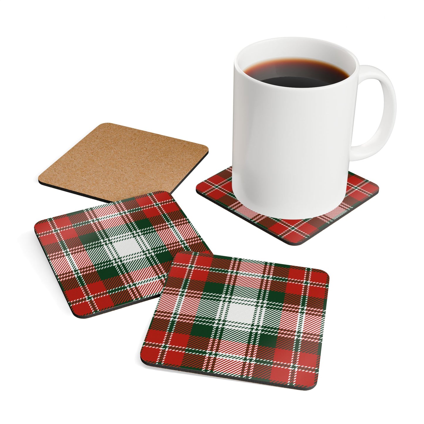 Set of green and red plaid coasters with a mug of coffee on a white background