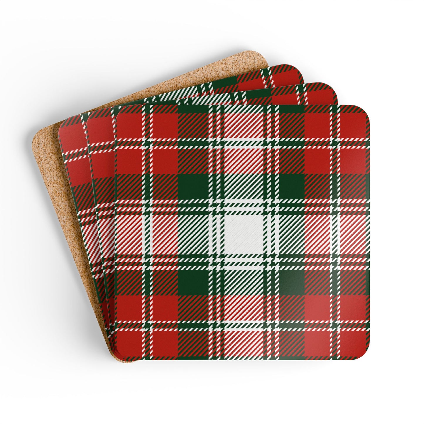Set of four green and red plaid coasters with cork backing on a white background