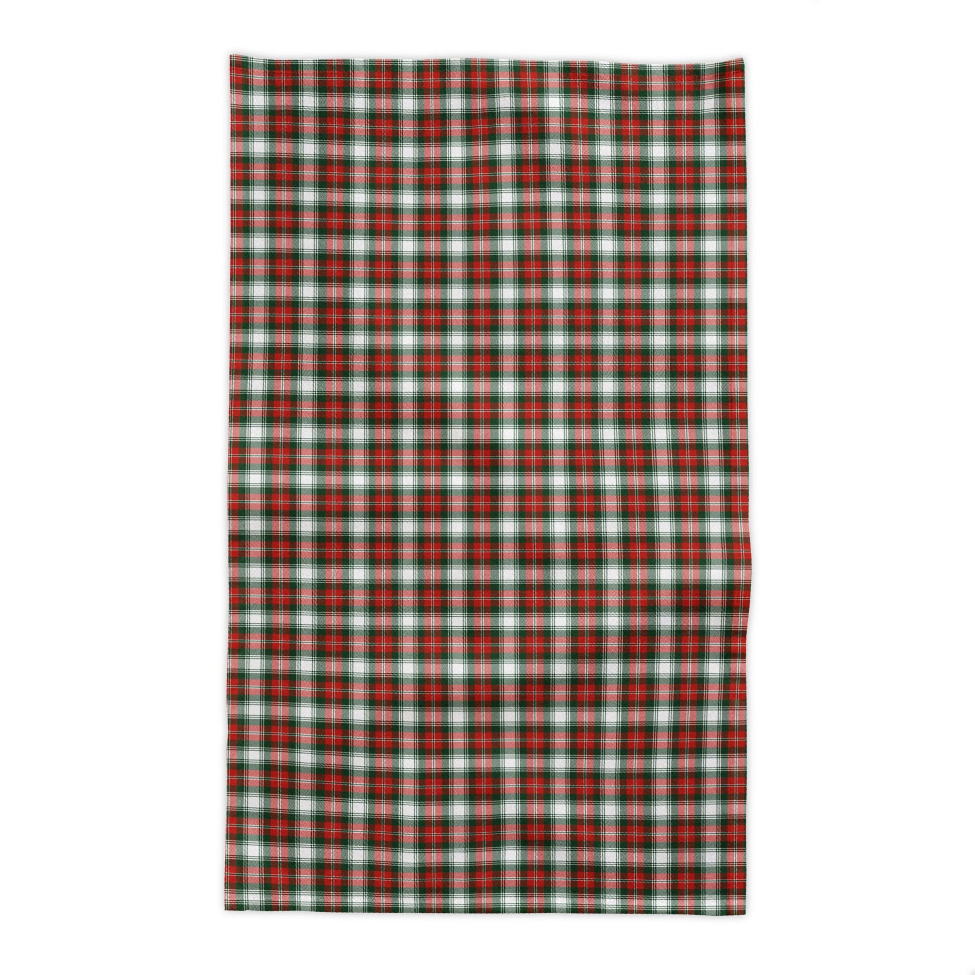 Red and green plaid tablecloth on a white background