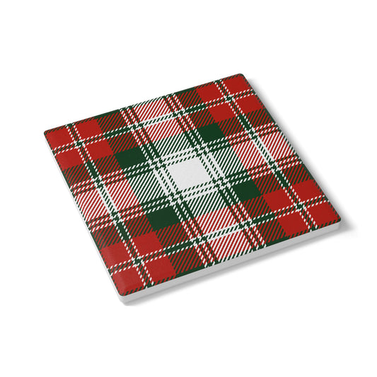 Plaid green and red patterned square ceramic tile coaster on a white background