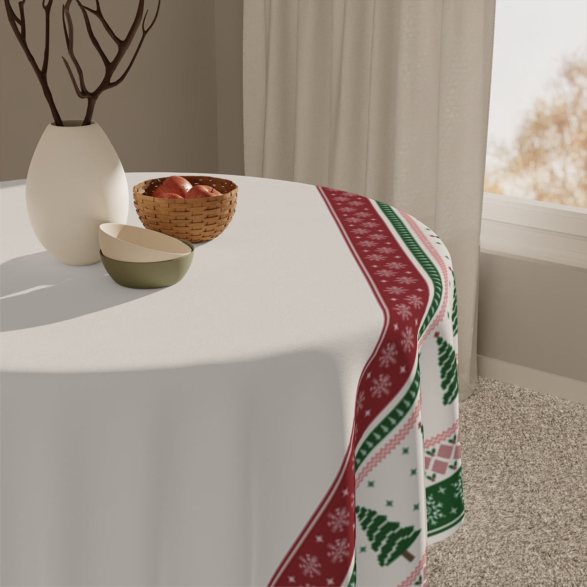 Tablecloth with a festive decorative tablecloth featuring green and red Christmas trees and snowflake pattern border on a table, with decorative items including a vase and bowl.