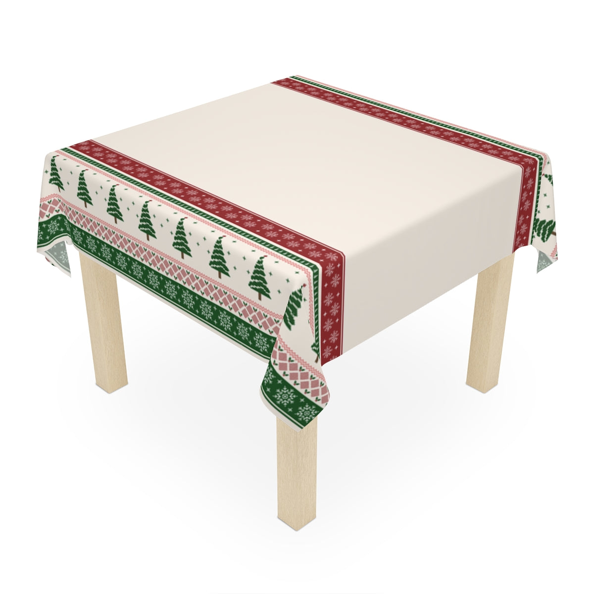Table with a decorative tablecloth featuring green and red Christmas trees and snowflakes pattern on a white background