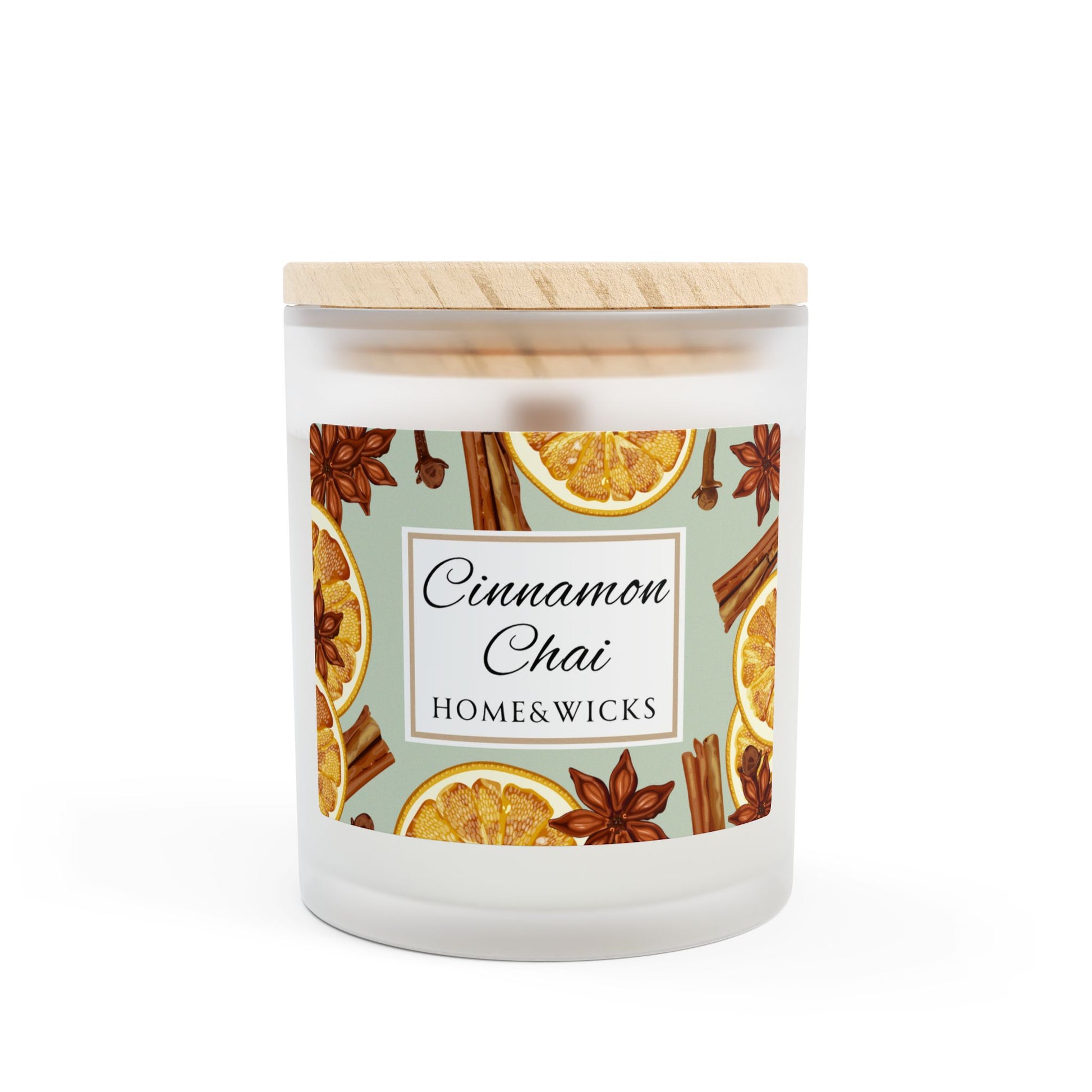 Candle with cinnamon, chai, and orange design on a white background