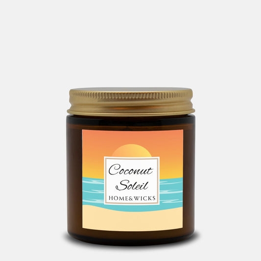 Coconut Soleil candle in 4 oz. amber glass jar with gold lid with a colorful sunset label on a white background by Home & Wicks