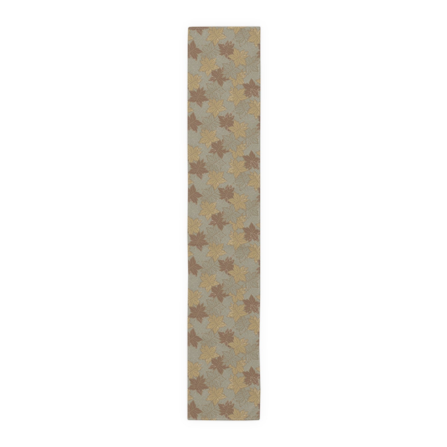 Rectangular table runner with leaf pattern on a plain background