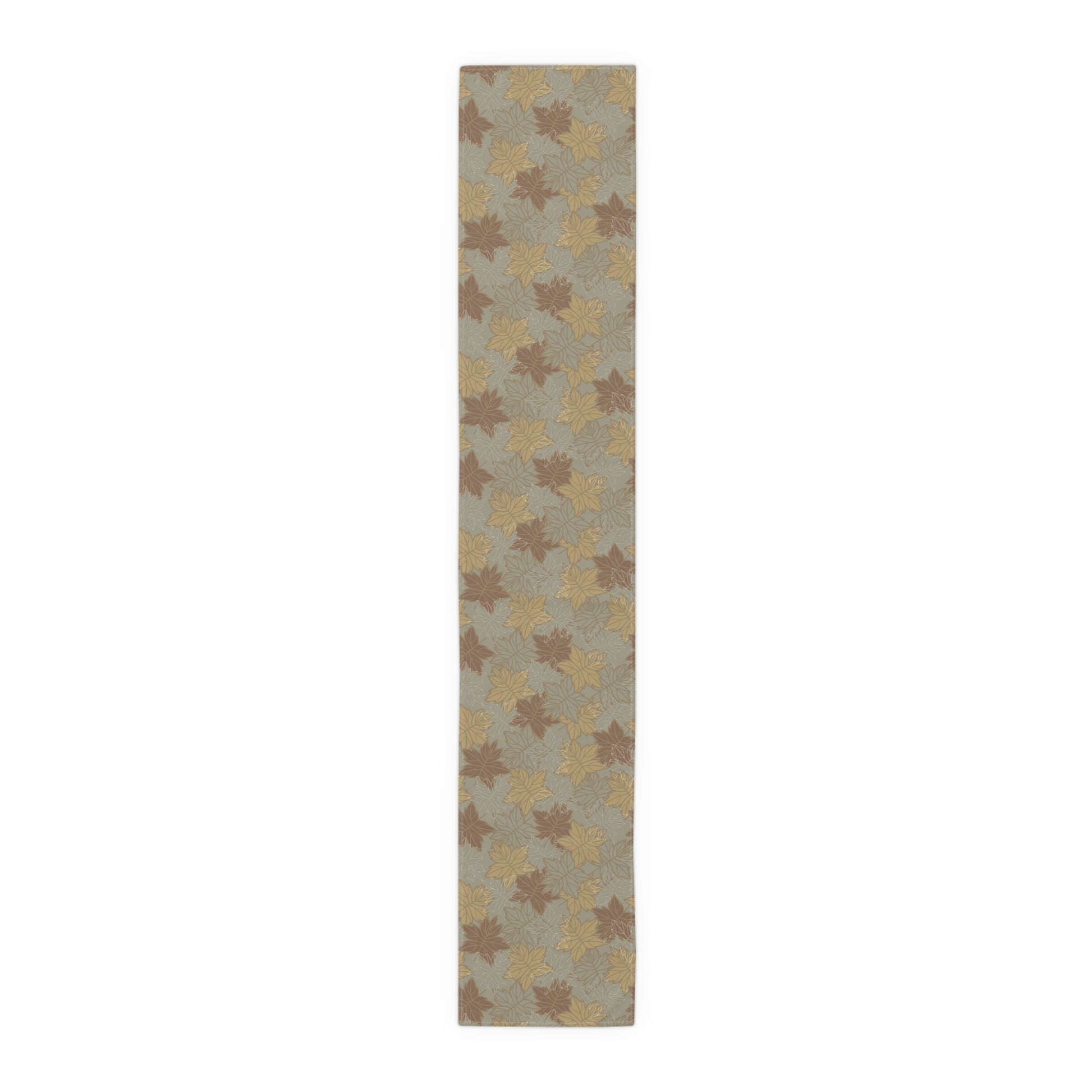 Rectangular table runner with leaf pattern on a plain background