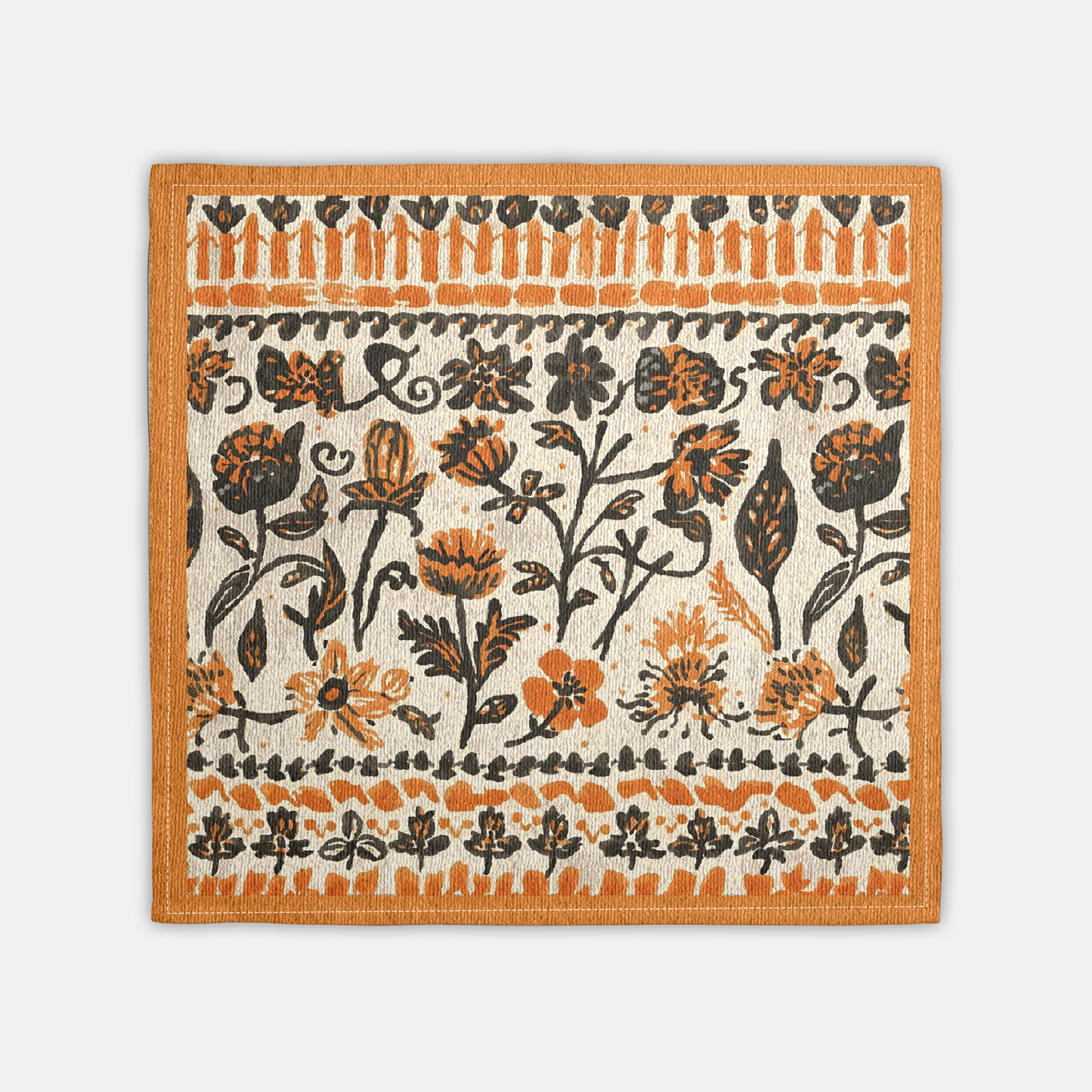 Fall Flowers napkin, with a boho orange and black floral pattern, is printed on a cotton twill reusable napkin fabric, on a white background