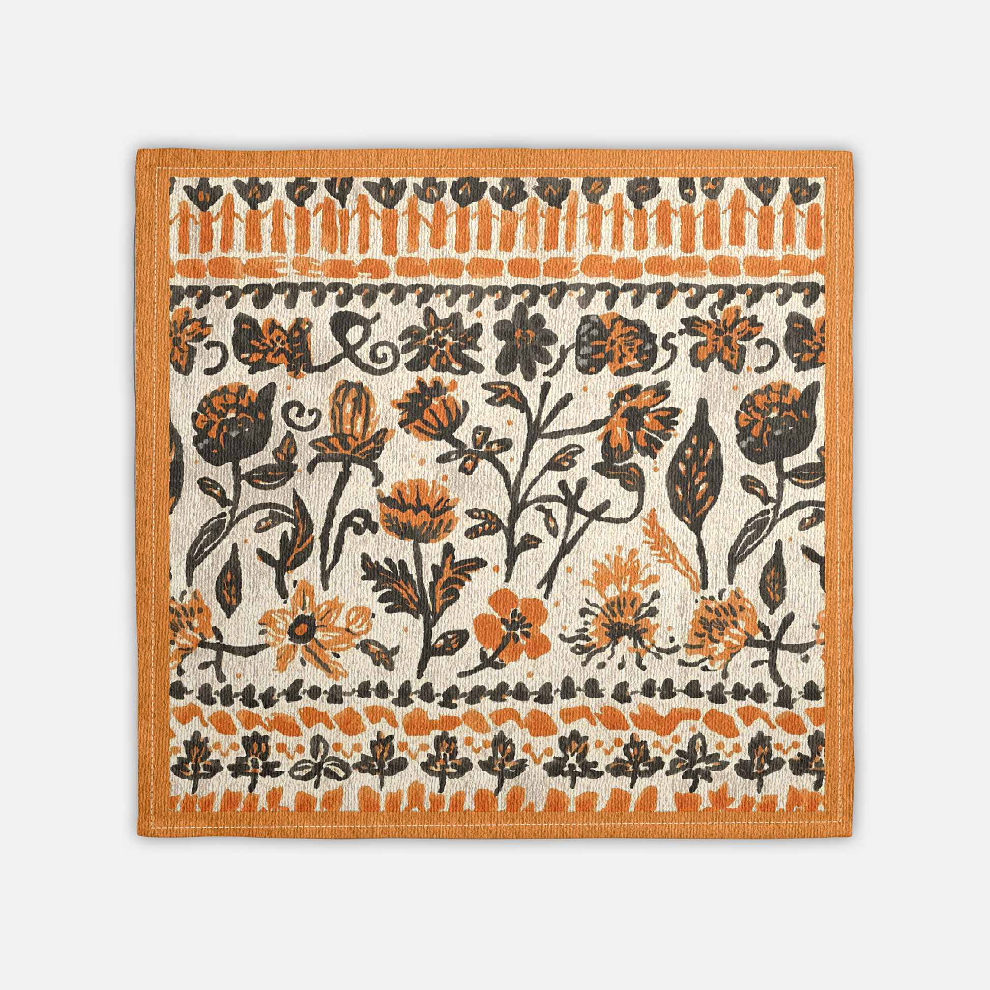 Fall Flowers napkin, with a boho orange and black floral pattern, is printed on a cotton twill reusable napkin fabric, on a white background