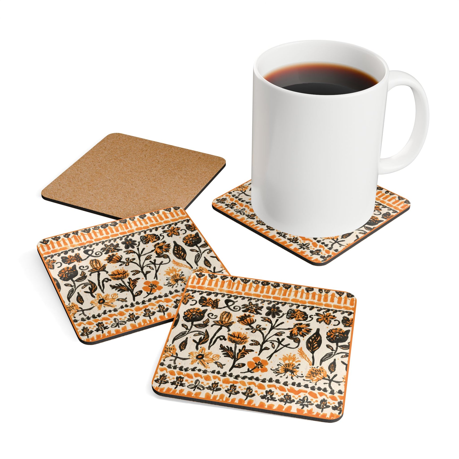 Set of four Fall Flowers coasters with a white mug on a white background