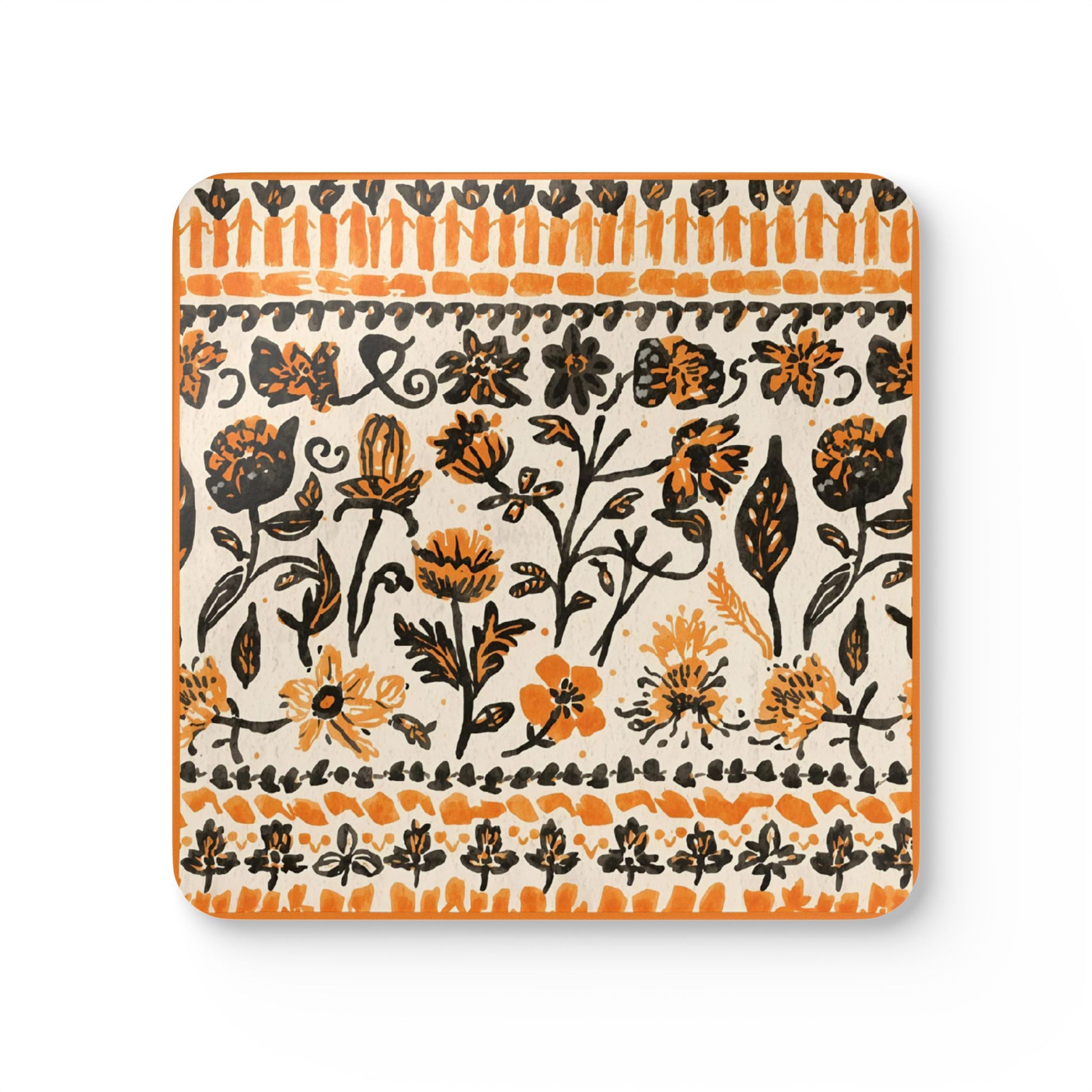 Decorative square coaster with black and orange floral pattern on a white background