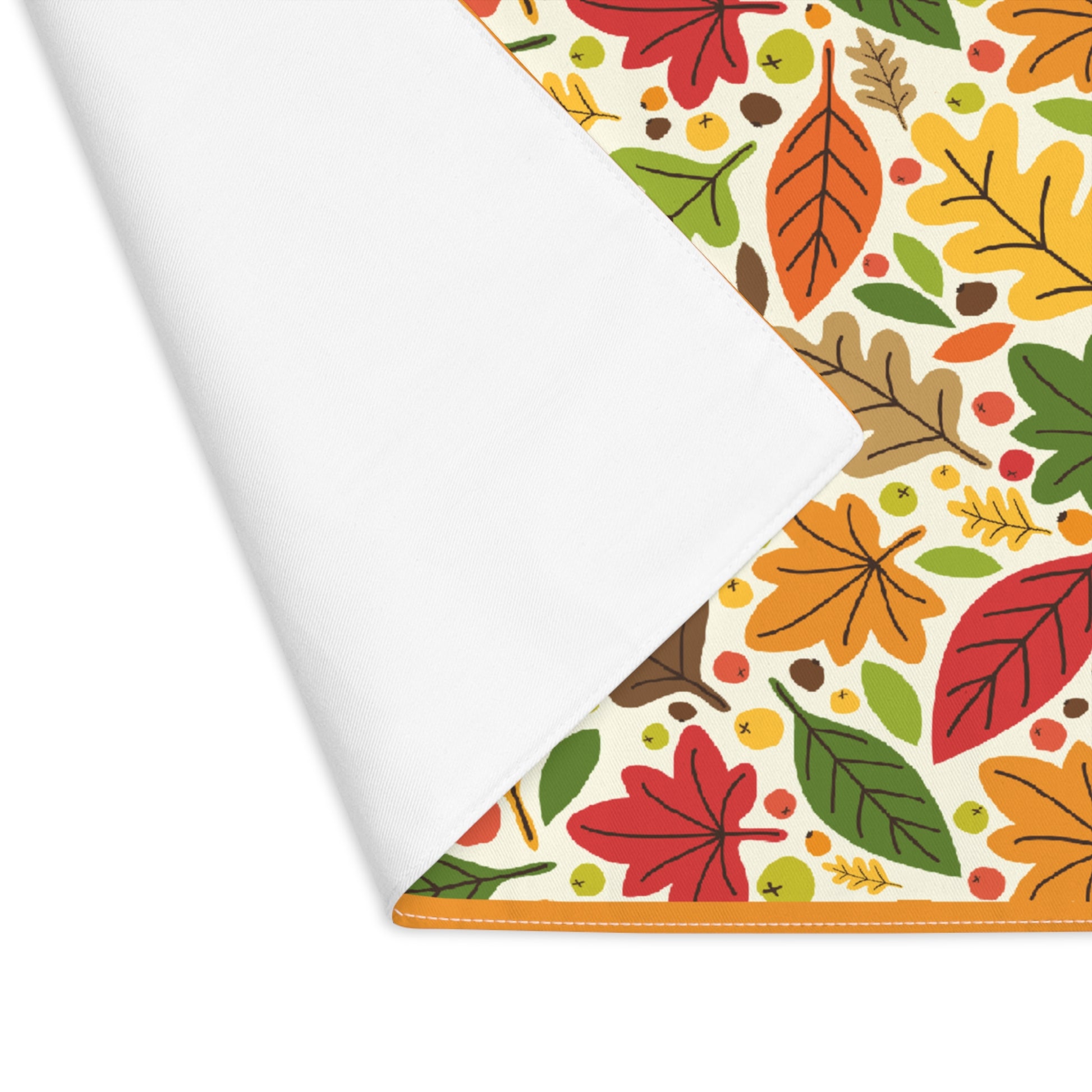 Fall Leaves placemat with autumn leaf pattern on the placemat's cotton twill fabric,  on a white background