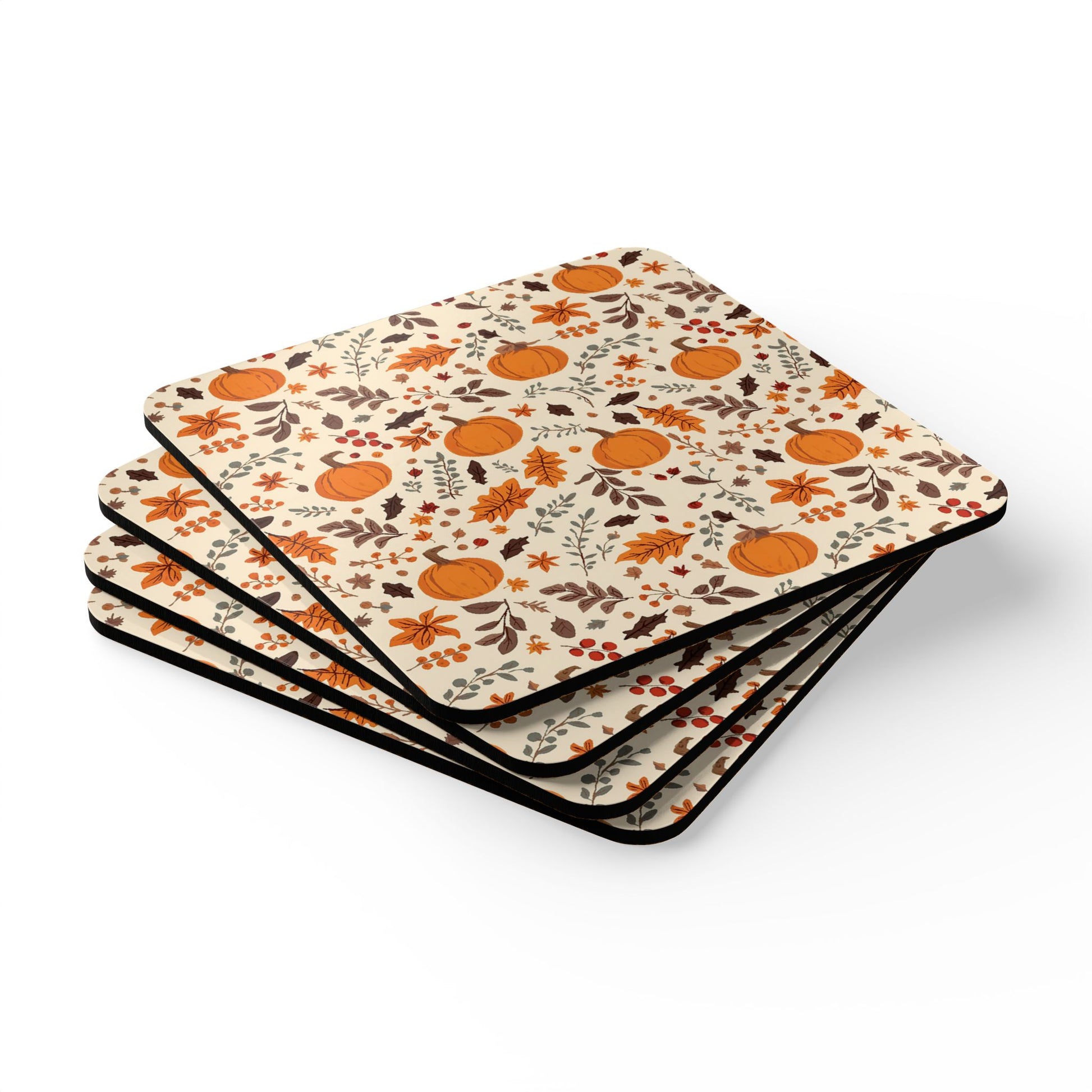 Set of four coasters with autumn-themed design with leaves and pumpkins on a white background