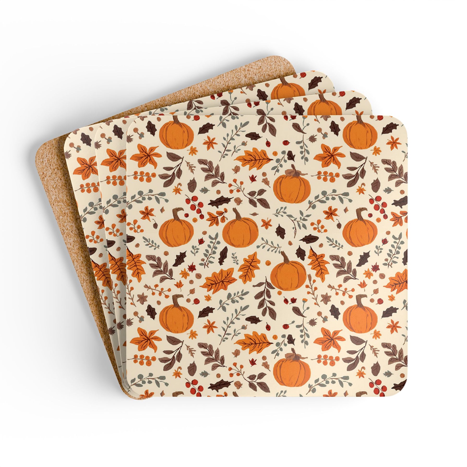 Set of four coasters with pumpkin and leaf pattern on a beige background