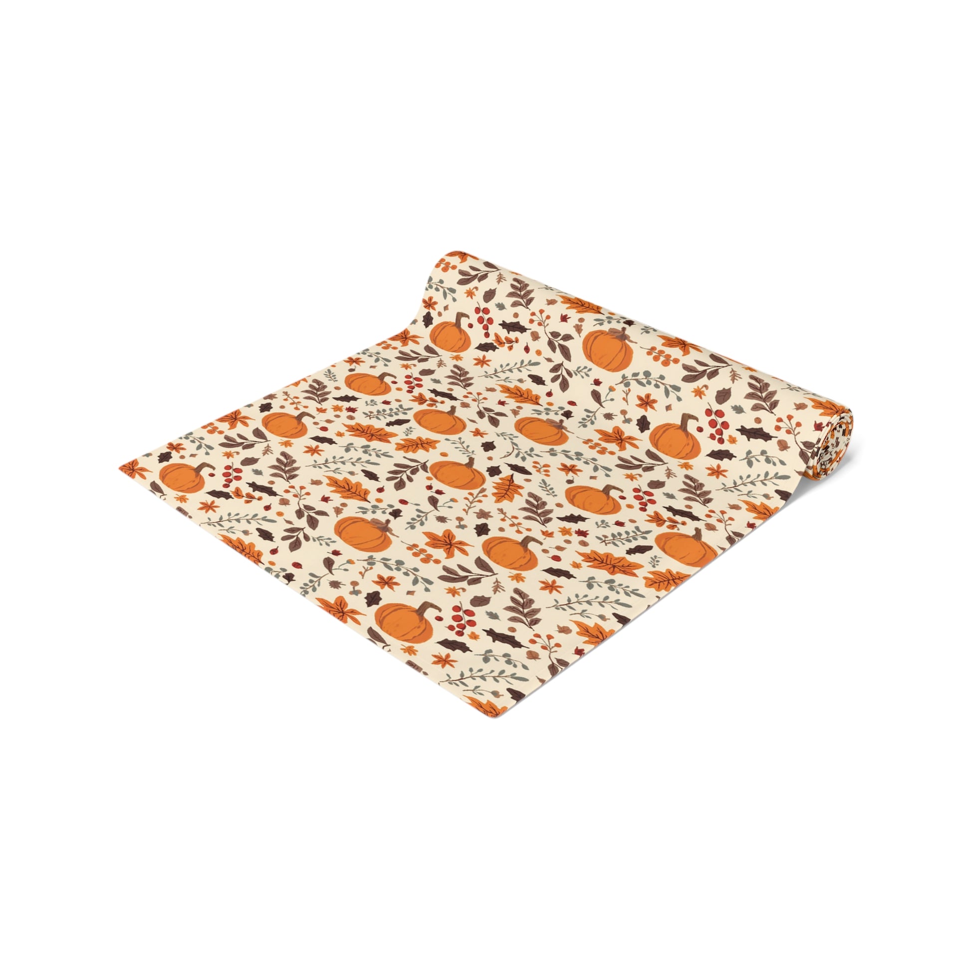 Fall Leaves and Pumpkins table runner has brown and orange fall leaves with orange pumpkins with beige background design printed on the table runner shown rolled up on a white background.
