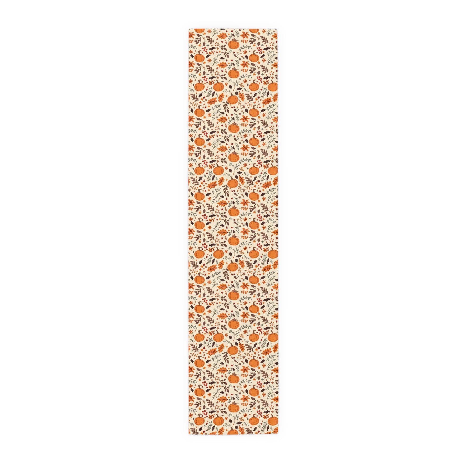 Fall Leaves and Pumpkins 16" x 72" polyester table runner has brown and orange fall leaves with orange pumpkins with beige background printed on the table runner shown on a white background.