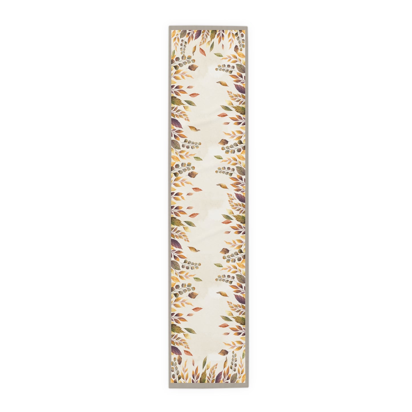 Long, narrow Fallen Leaves table runner with leaf pattern on a white background