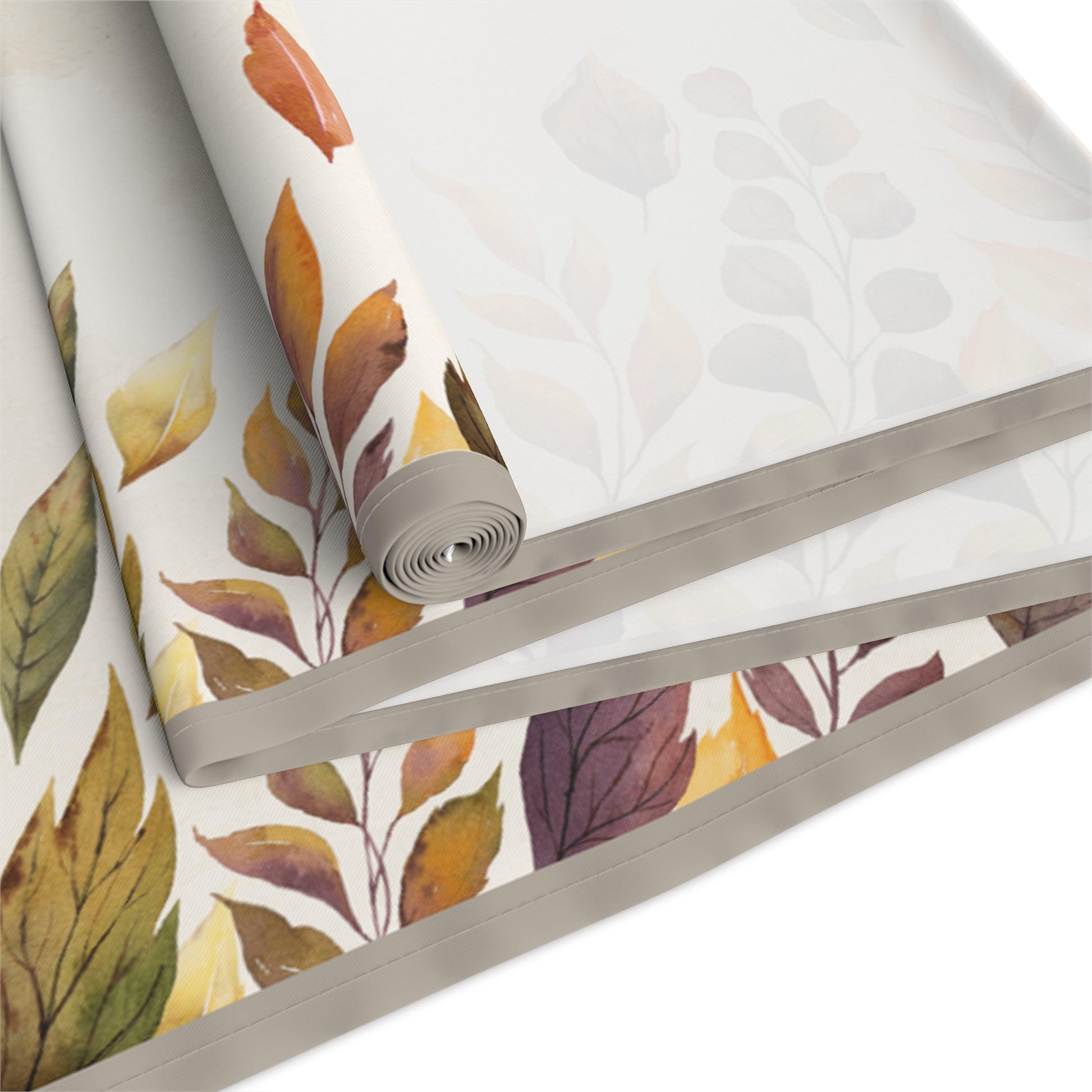 Roll of Fallen Leaves table runner with autumn leaf pattern on a white background