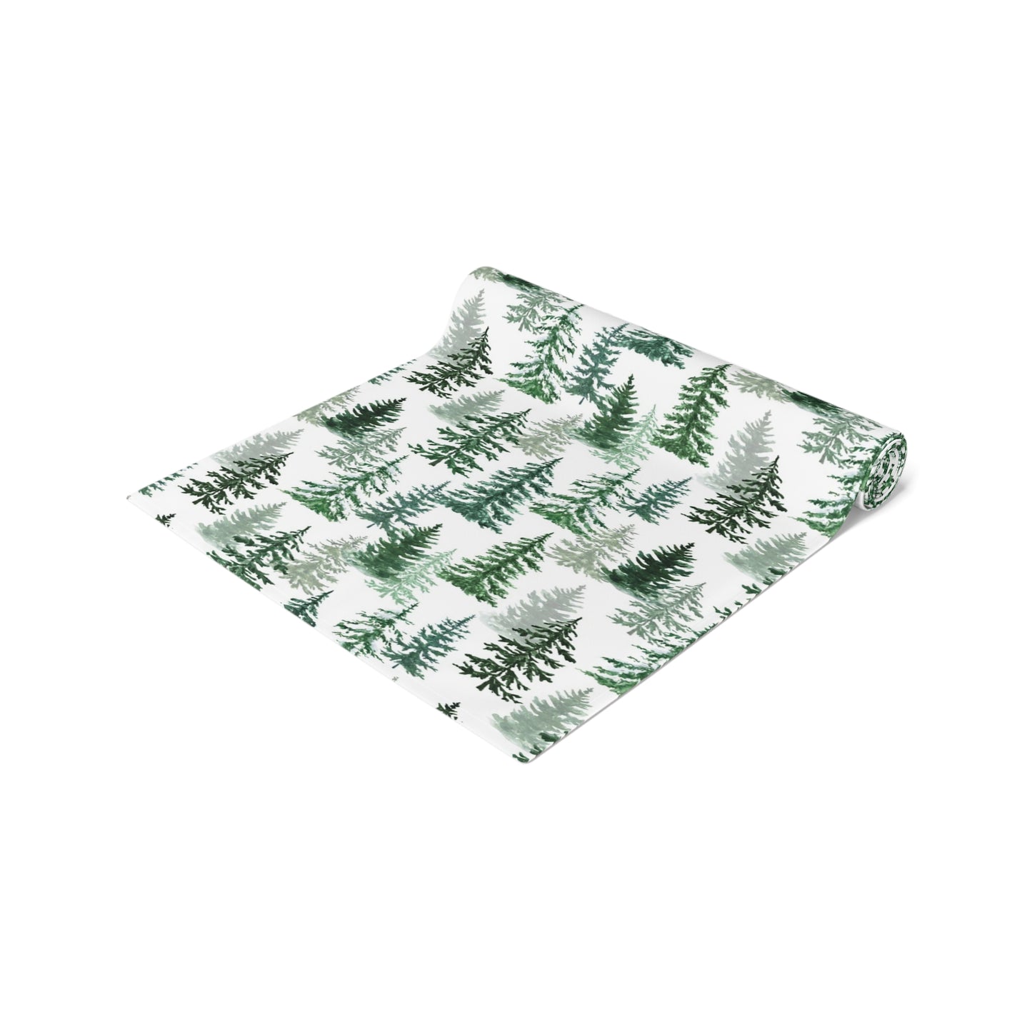 Green and white forest-themed cotton table runner rolled up on a white background