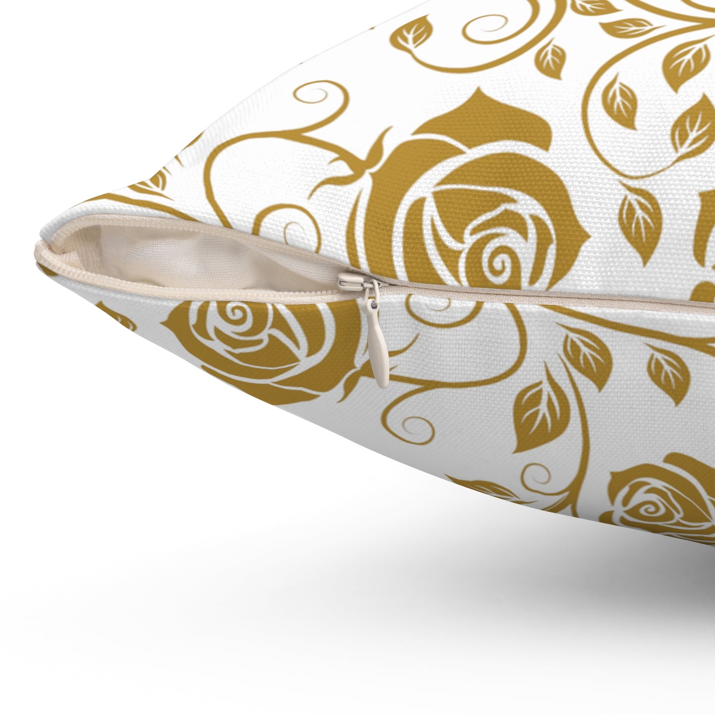 Gold floral patterned pillow with zipper closure on a white background