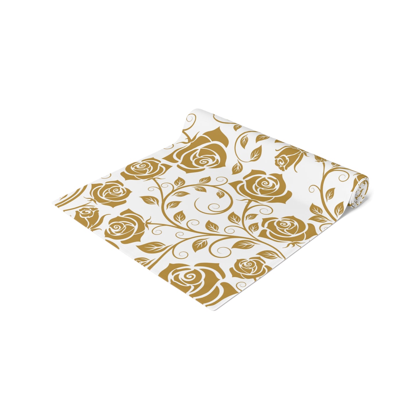 Gold floral patterned table runner with gold roses rolled up on a white background